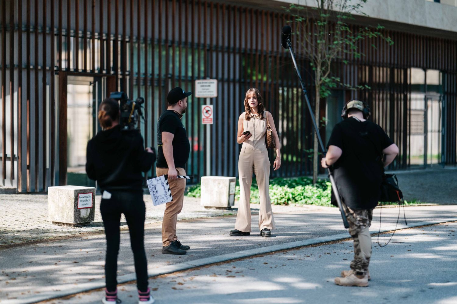 Location shoot with camera, boom and slate