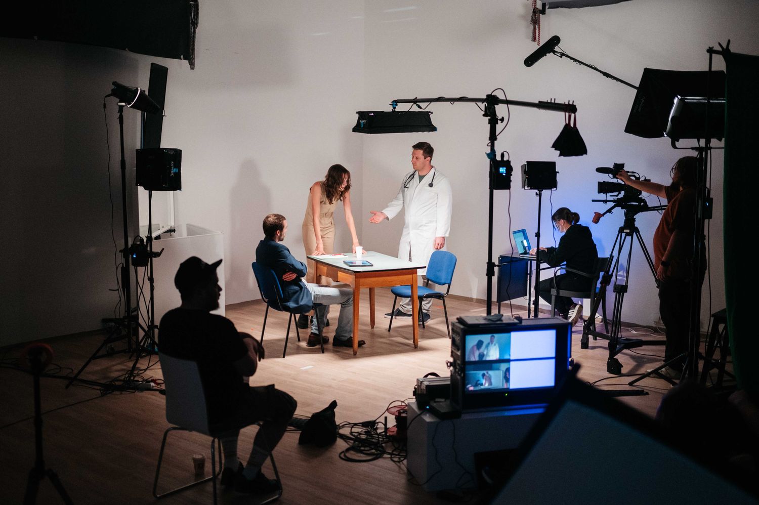 Scene being shot in the studio with cast and crew